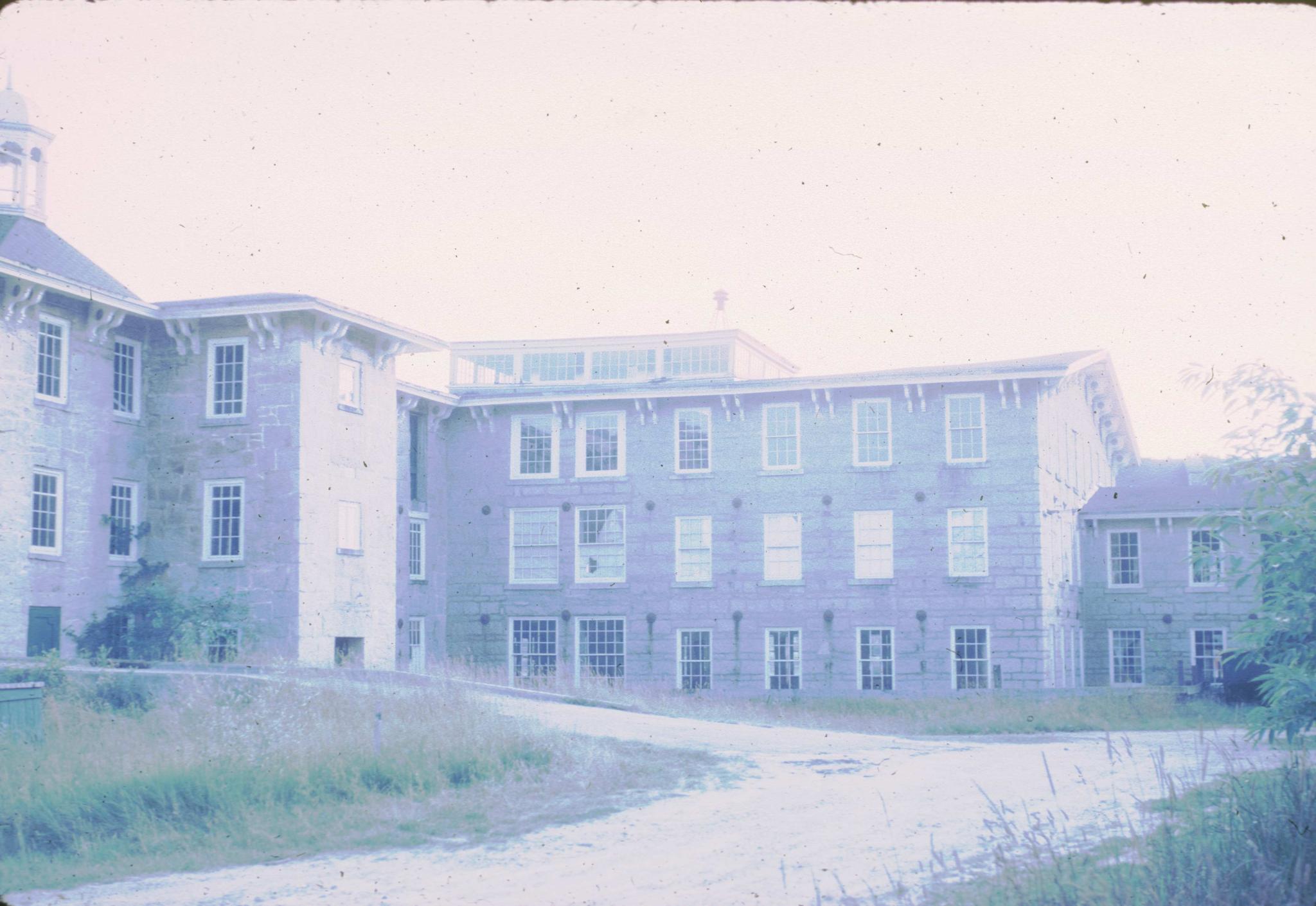 Photograph of the Old Mill (1826).  The photograph is over-exposed and faded.