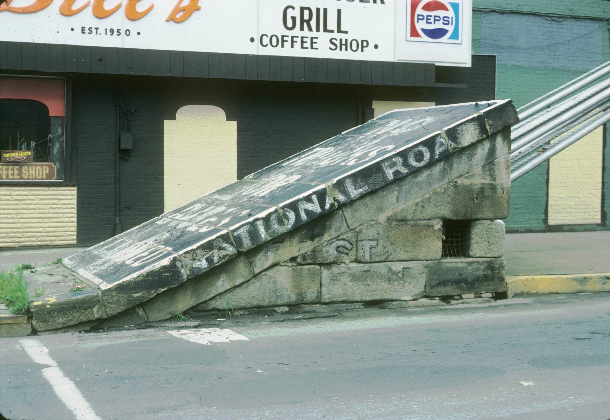 Photograph of an anchorage of the bridge labeled "National Road."