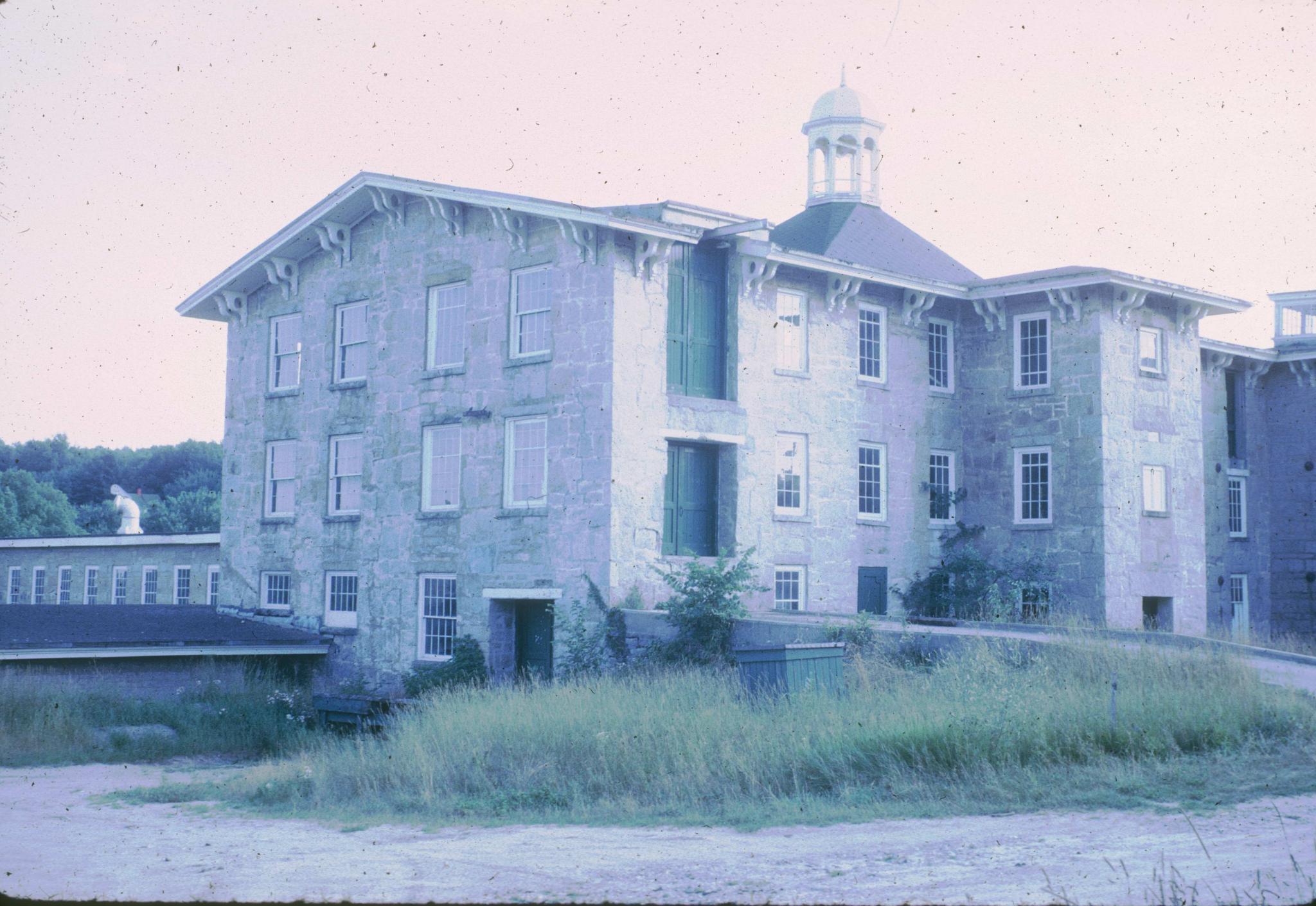 Photograph of the Old Mill showing the front and side elevations.